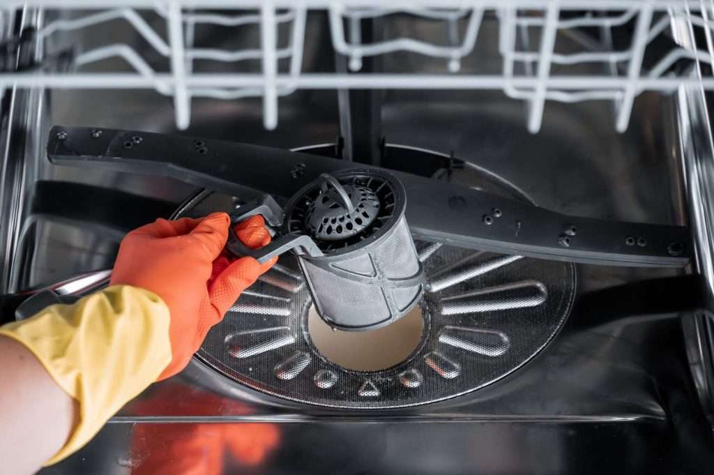 Dishwasher smell common cause: time to clean the dishwasher filter.