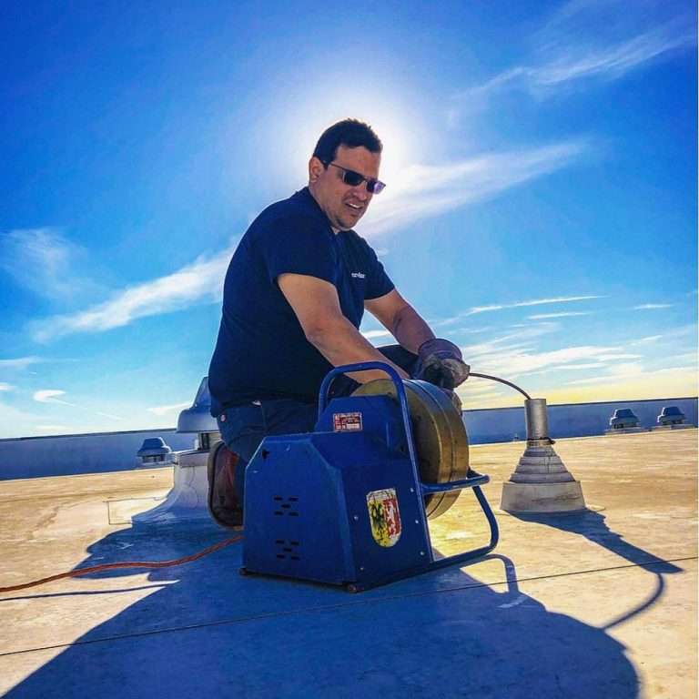 Tony clearing a sewer roof vent.