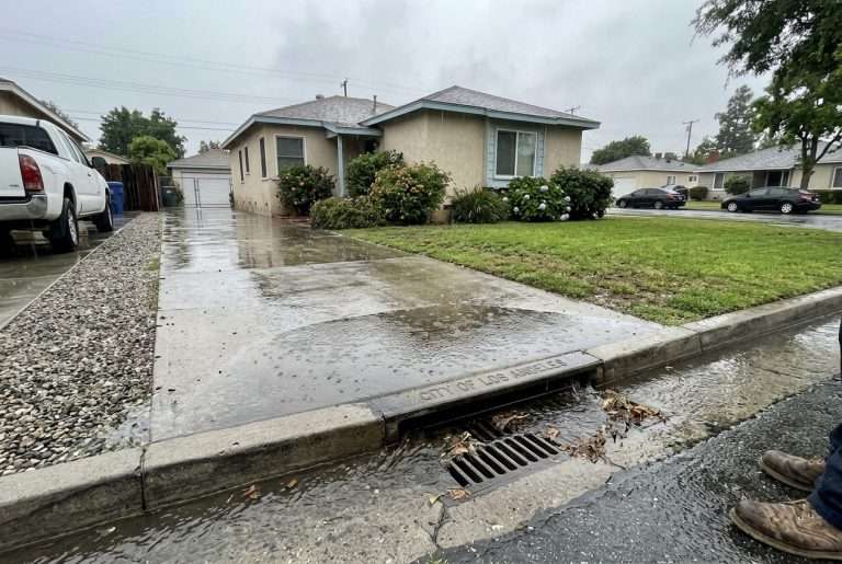 Rainwater pooling near a storm drain during a Southern California storm